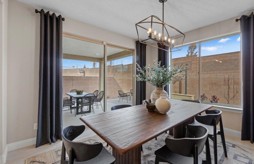Great sized dining room off the kitchen includes access to the backyard and covered patio through th