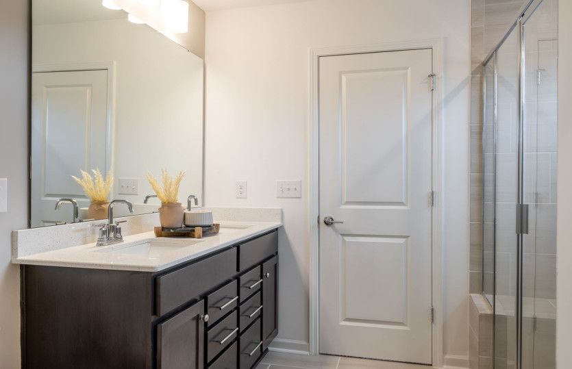 Owner's Bath with Walk-in Shower, Double Bowl Vanity and Linen Closet