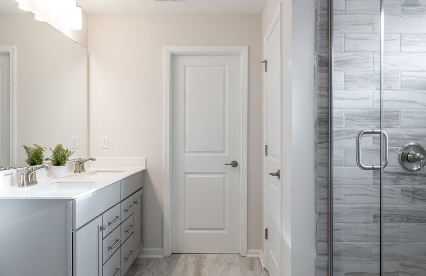 Owner's Bathroom with Dual Bowl Vanity and Walk-in Shower