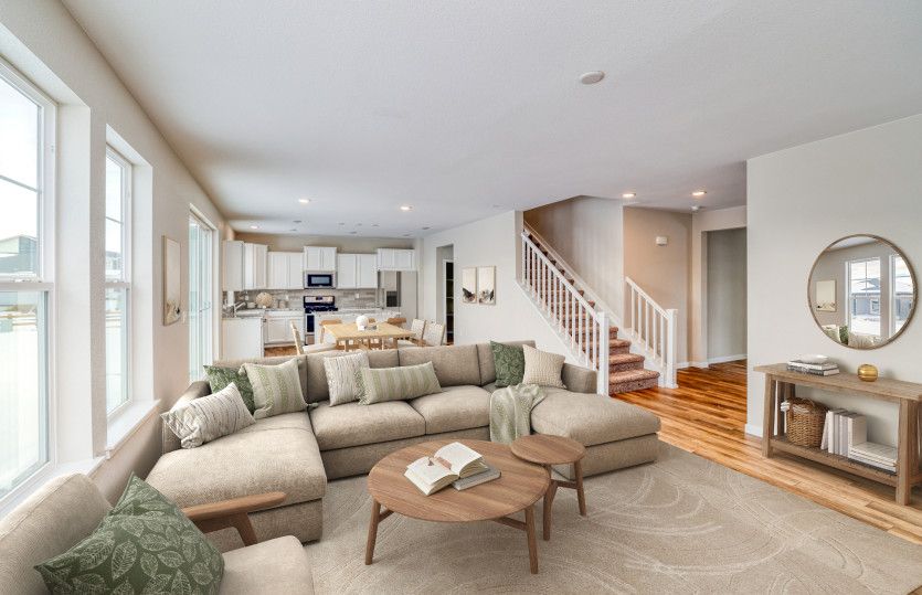 The main living areas are brightly lit with natural light thanks to the large windows throughout.