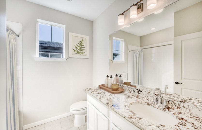 The secondary bathroom can be upgraded with things like stylish granite countertops and accent penda