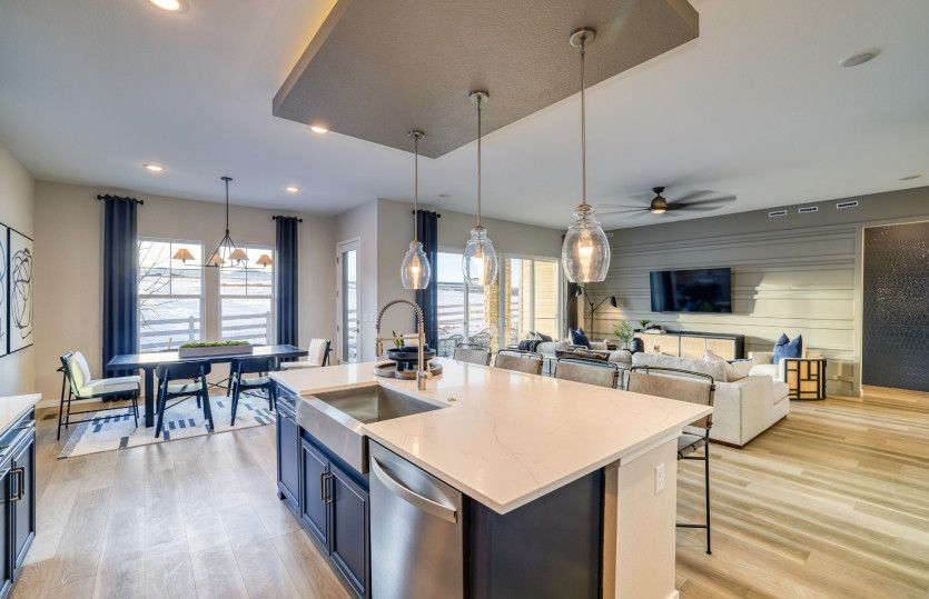 The functional kitchen island boasts a built-in dishwasher to make cleaning after meals a breeze.