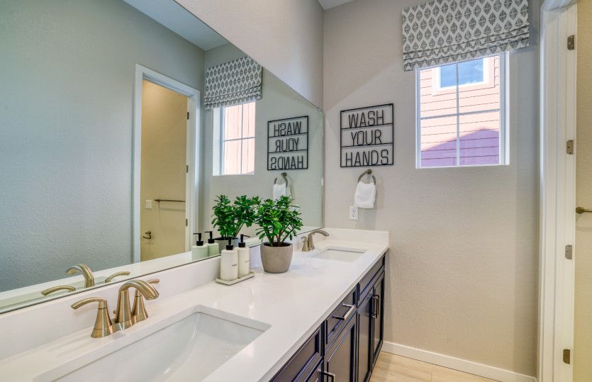 Enjoy functional dual sinks in the secondary bathroom.