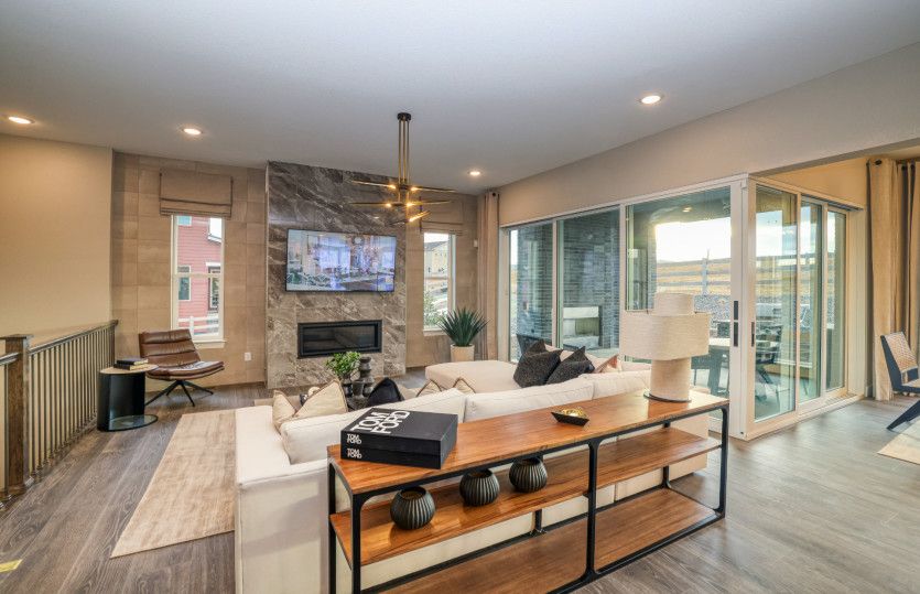 Enhance the gathering room with the corner sliding glass door upgrade to seamlessly transition to th