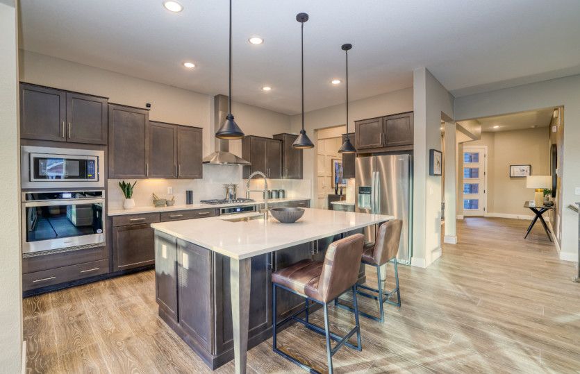 Enjoy your coffee each morning at the bar built directly into the kitchen island.