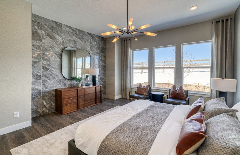 The owner's suite can be enhanced with design upgrades like this stunning, tile accent wall.