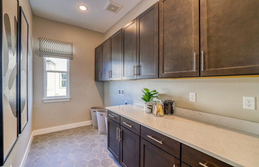 Enhance your laundry room with added cabinets for additional storage.
