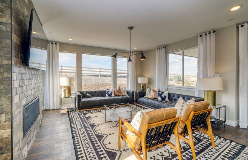 The gathering room boasts large windows throughout and a cozy fireplace.