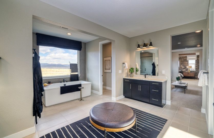 The owner's bath makes getting ready each morning a breeze with the split sinks.