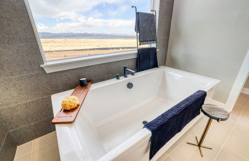Enjoy beautiful views and relax in the freestanding tub.