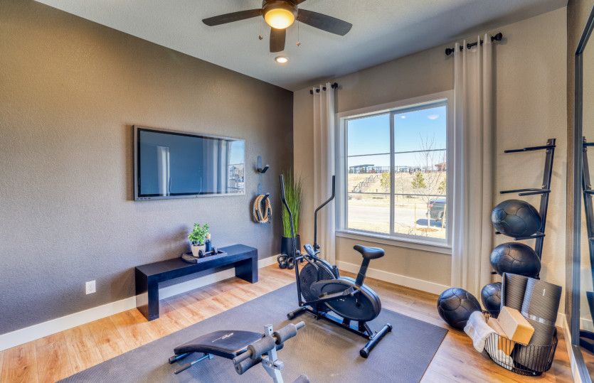 Secondary bedroom shown as a functional, at home gym.
