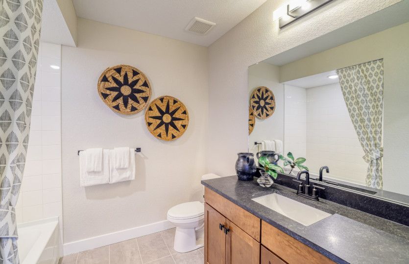 The basement bathroom features a full shower/tub combo.