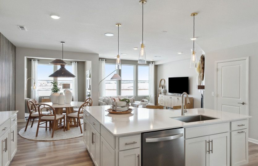 Gazing into the kitchen, sunroom, dining room, and gathering room