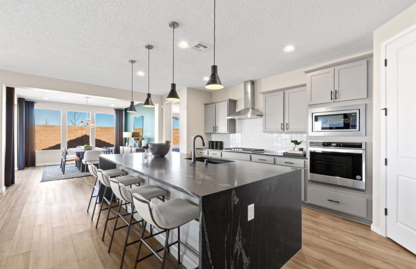 Enhance your home with upgrades like black granite countertops and overhead pendant lighting.