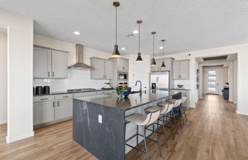 The Parklane kitchen features tons of storage with cabinets throughout and a spacious corner pantry.