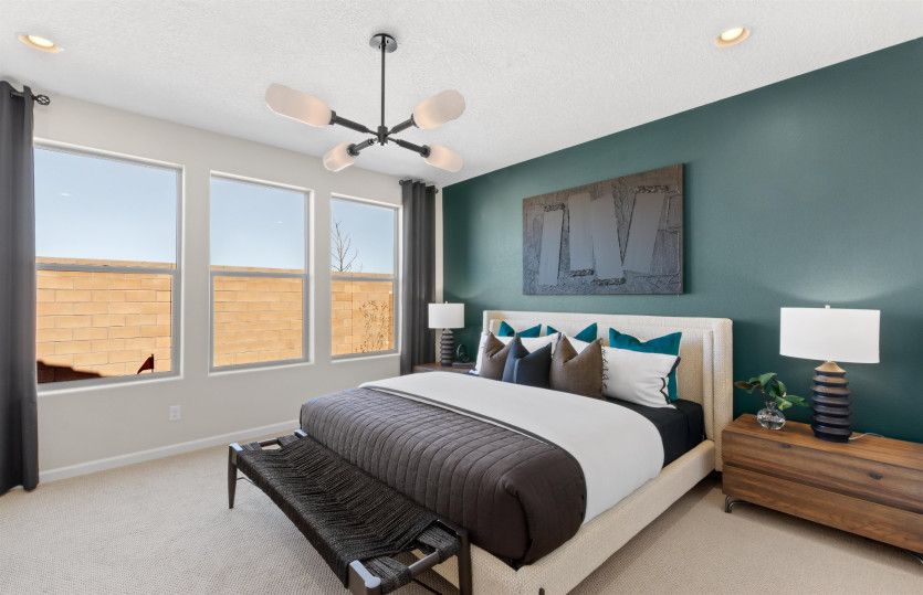 Enter the owner's suite which features large windows that let in tons of natural light.