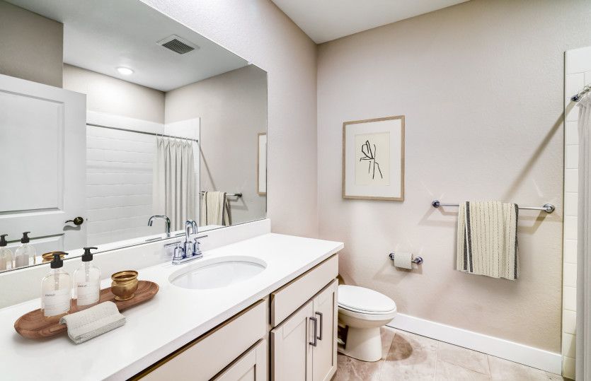The basement bathroom features a full shower/tub combo.