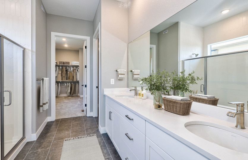The owner's bath makes getting ready each morning a breeze thanks to the dual sink vanity.