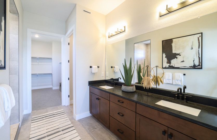 Getting ready each morning is a breeze thanks to the large, dual sink vanity.