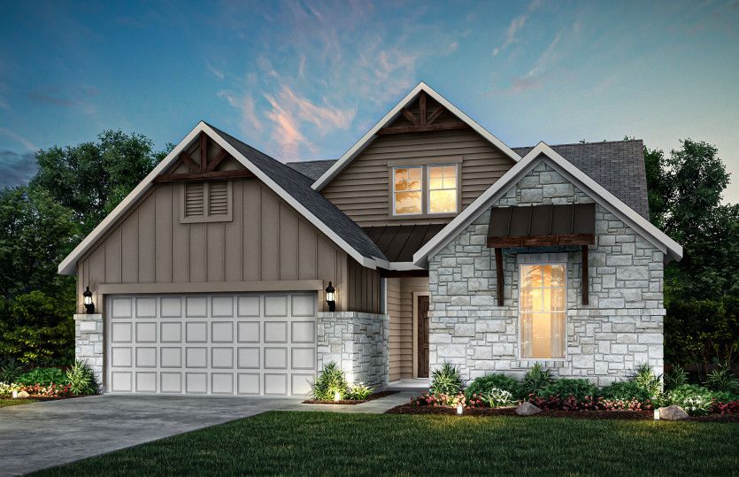 Exterior K with stone and a 2-car garage with storage space