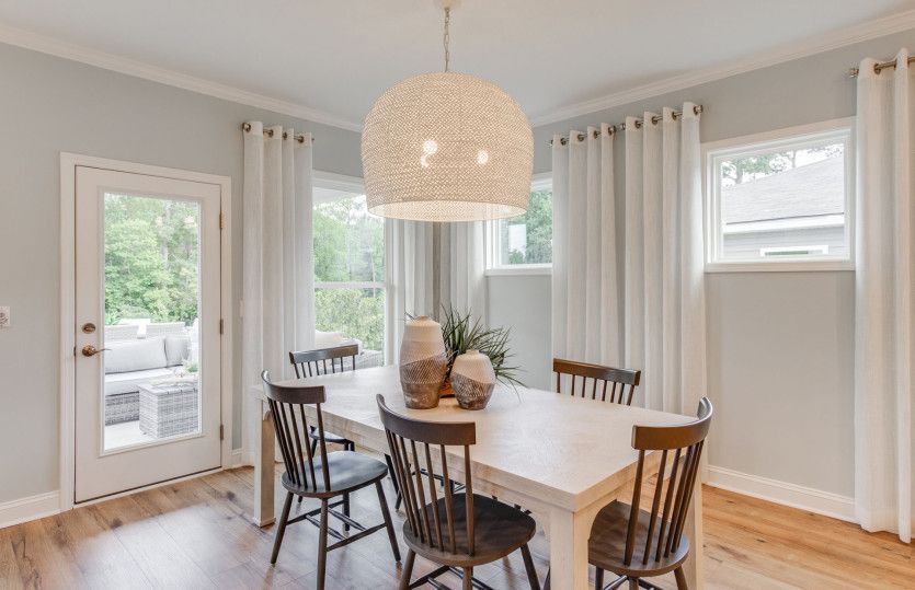 The breakfast Café leads to the screen porch for alfresco dining.