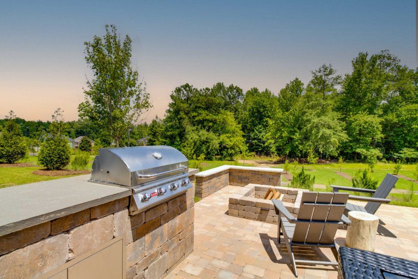 Fire up the grill and enjoy a delicious meal with friends on the patio.