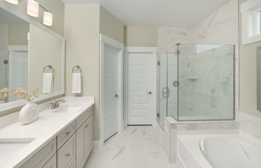 Owner's bath with walk-in shower and glass surround
