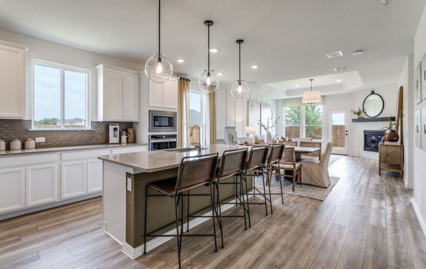 Spacious island kitchen with pendant lighting