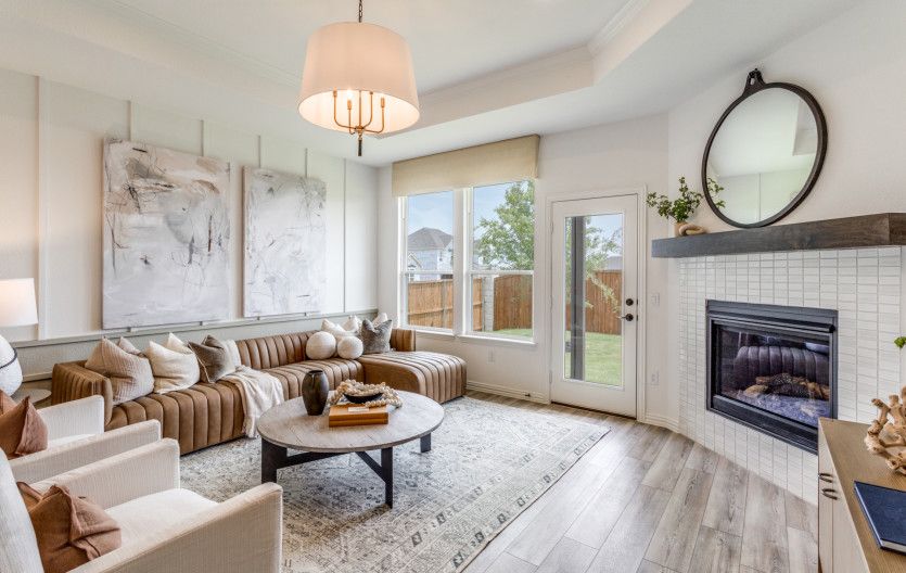 Gathering room with large windows and tray ceiling