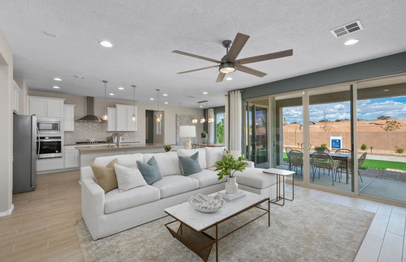 A large sliding glass door takes your indoor gatherings to the backyard and covered patio.