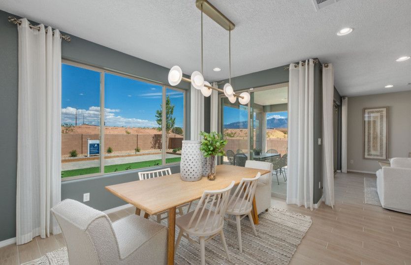 The café is brightly lit thanks to the large window and sliding glass door to the backyard.