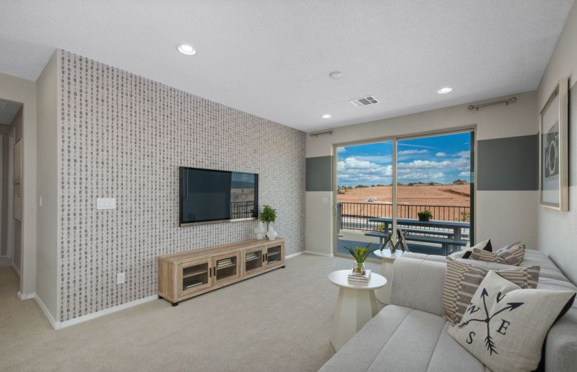 Upstairs you'll find a spacious loft with access to the balcony, perfect for family entertainment.