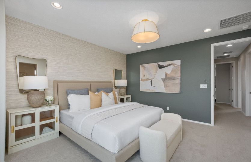 The owner's suite features a decorative accent wall, a spacious walk-in closet and owner's bath.