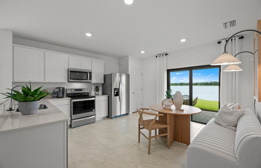 Naturally lit dining area that flows from the kitchen