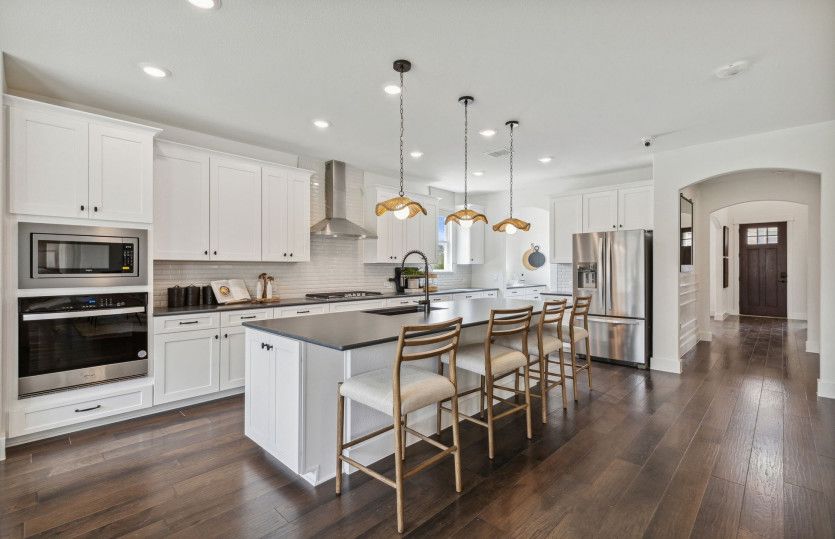 Eat-in island kitchen with pendant lighting
