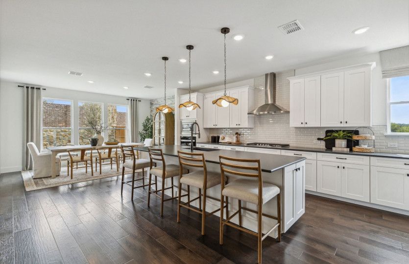 Open-concept layout throughout kitchen, dining, and gathering areas