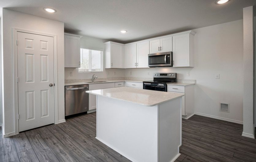Eat-in island kitchen and abundant cabinet space