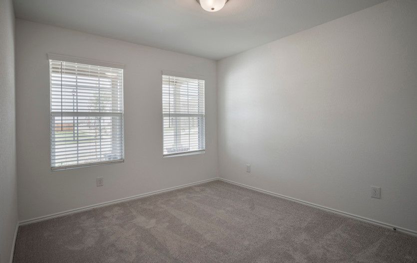 First floor bedroom with large windows
