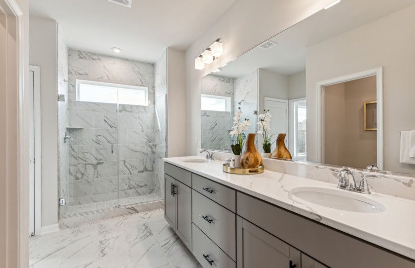 Double Sinks and an Oversized Walk-in Shower in the Primary Bath