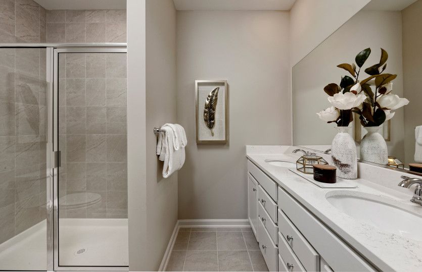 Owner's Bath with a Walk-in Shower and Dual Bowl Vanity