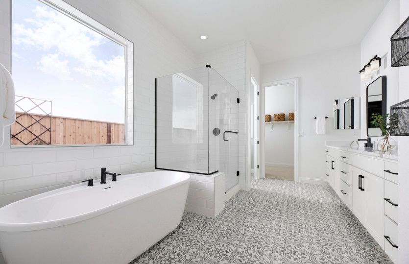 Owner's suite bathroom with freestanding tub
