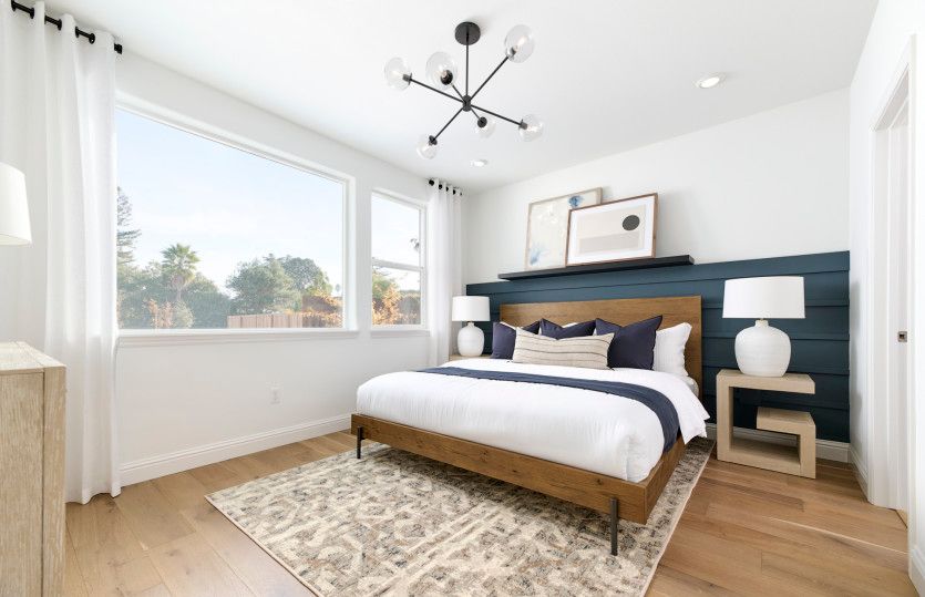 Owner's suite bedroom with large windows