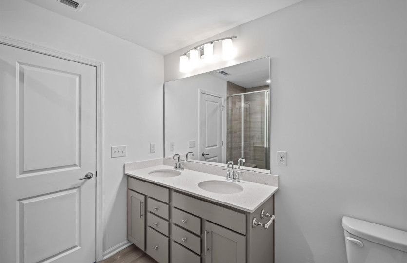Owner's Bath with Dual Bowl Vanity and Walk-In Shower