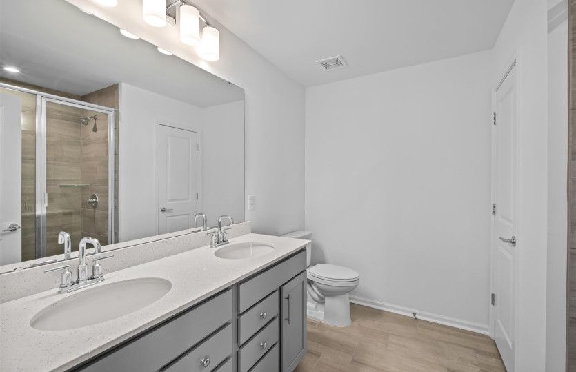 Owner's Bath with Dual Bowl Vanity and Walk-In Shower