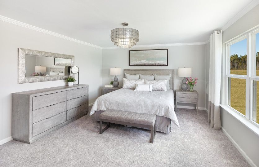 Retreat to a relaxing Owner's Suite with large windows.