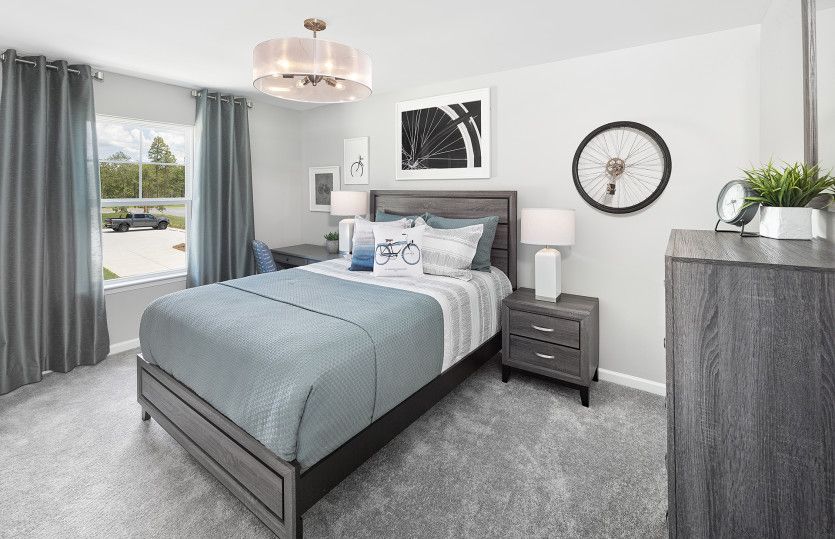 Plenty of space to relax in the new home Aspire guest bedroom.