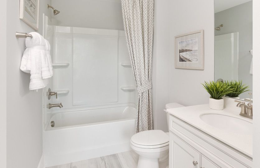 Secondary Bathroom with a spa-like soaking tub