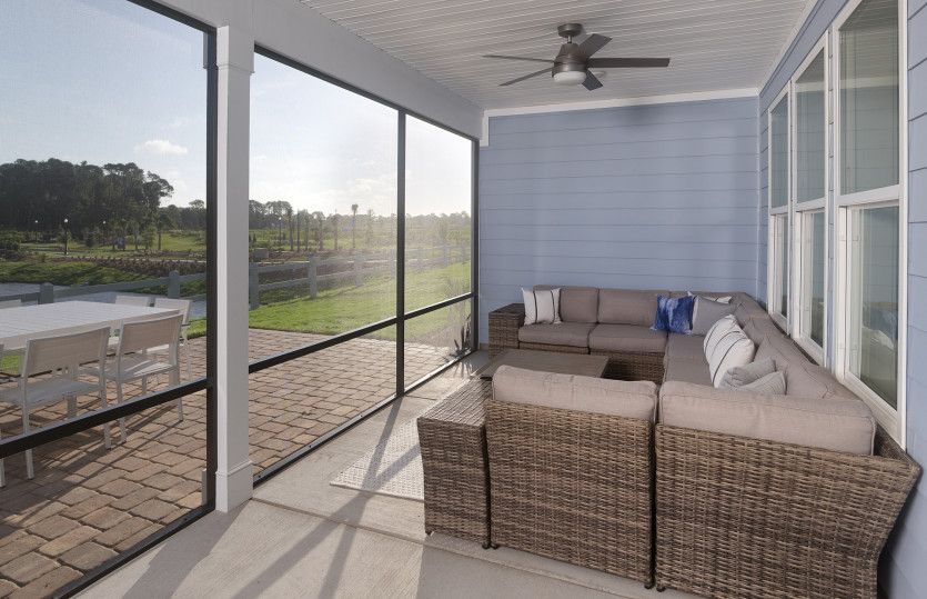 Screened porch with plenty of space for outdoor furniture.