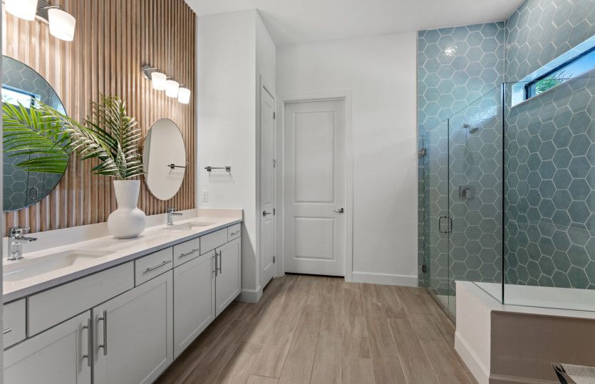 Owner's bathroom with dual sink vanity & large shower