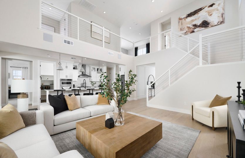 Open gathering area with view of kitchen